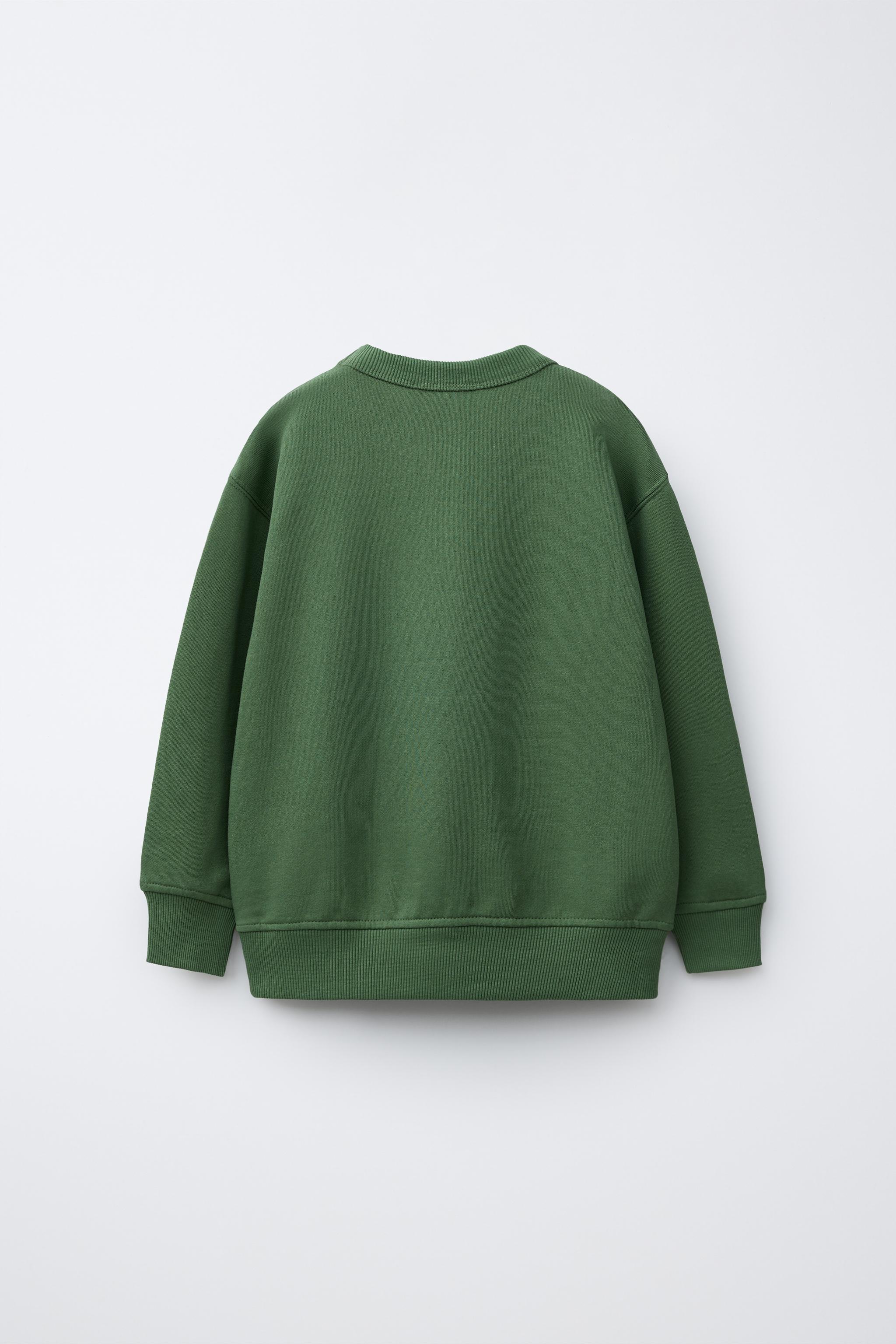 RAISED TEXT SWEATSHIRT